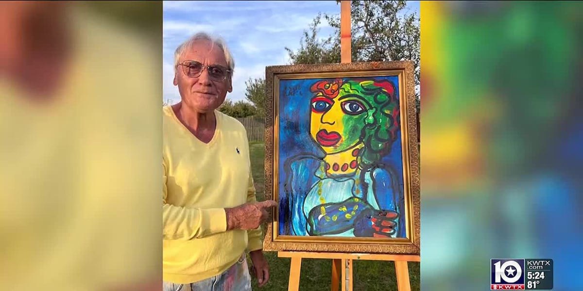 Peter Robert Keil holding a painting in the KWTX exhibition report.