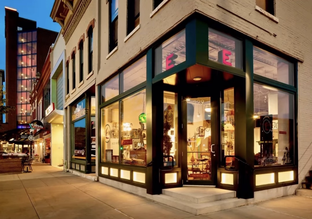 The illuminated Epic Finds gallery storefront in Waterloo, Iowa